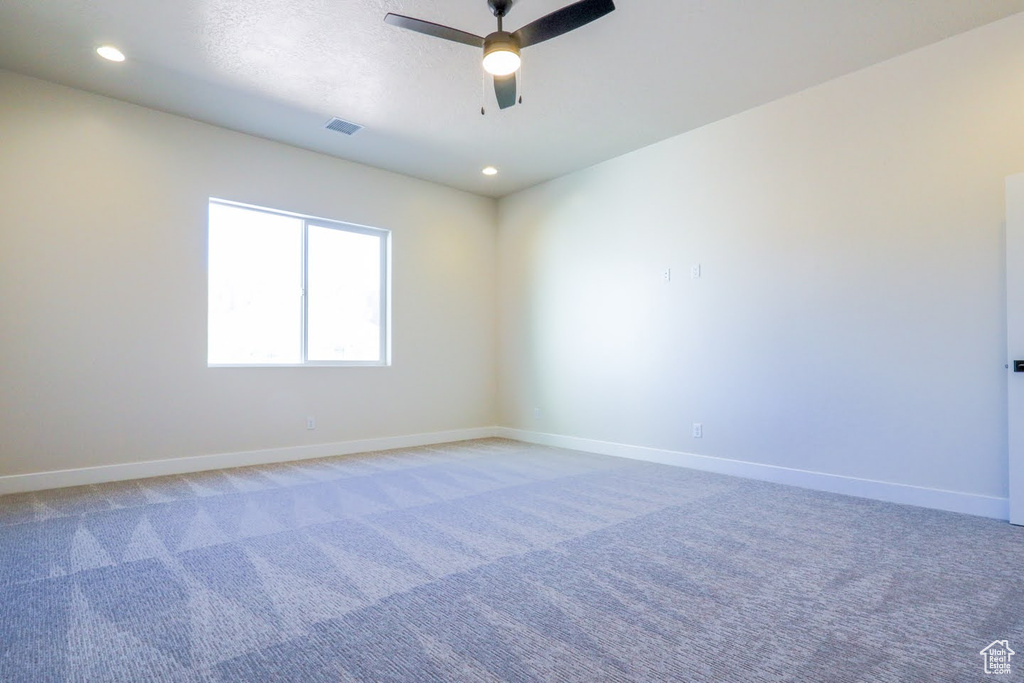 Unfurnished room with carpet flooring and ceiling fan