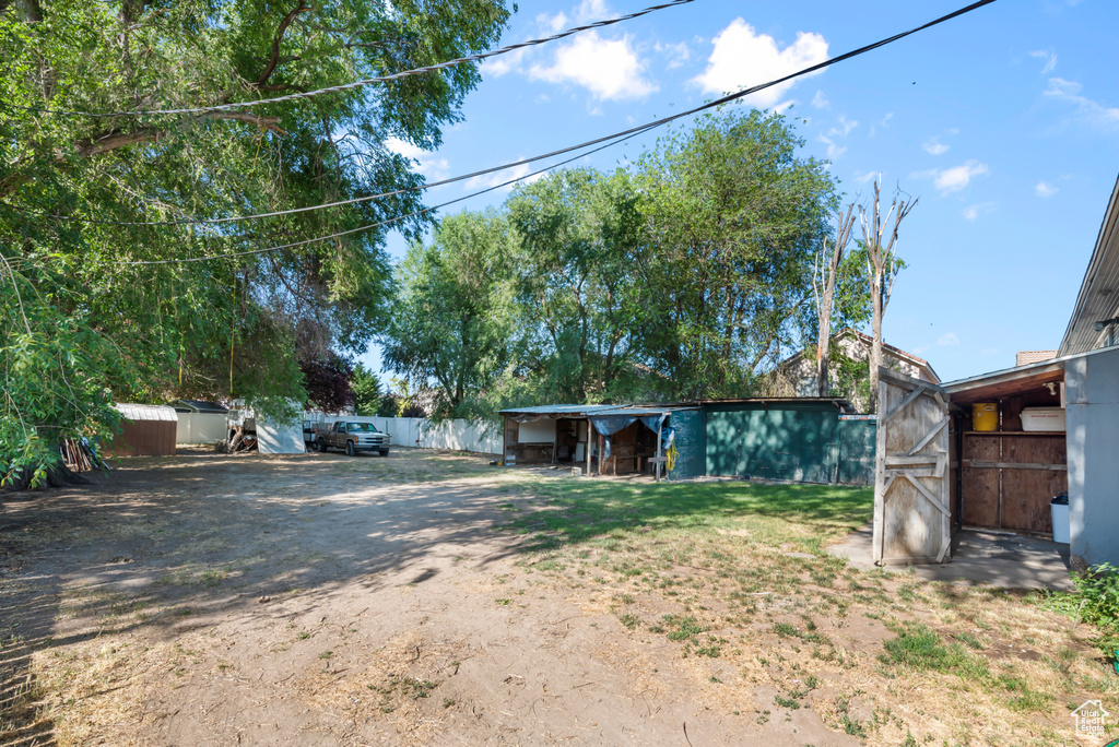 View of yard featuring a storage unit