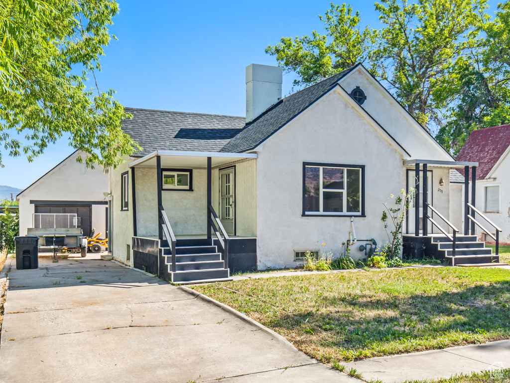 View of front of property with a front yard