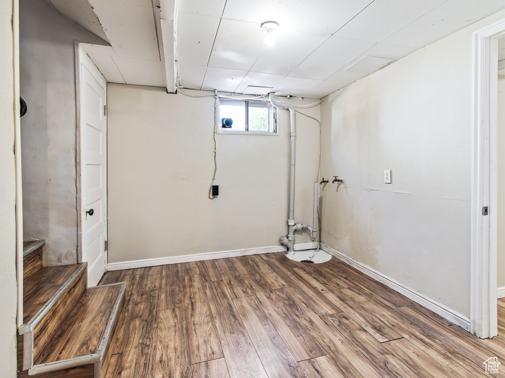 Basement featuring hardwood / wood-style flooring