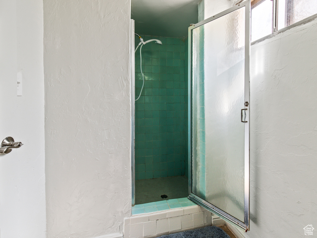 Bathroom featuring a shower with shower door