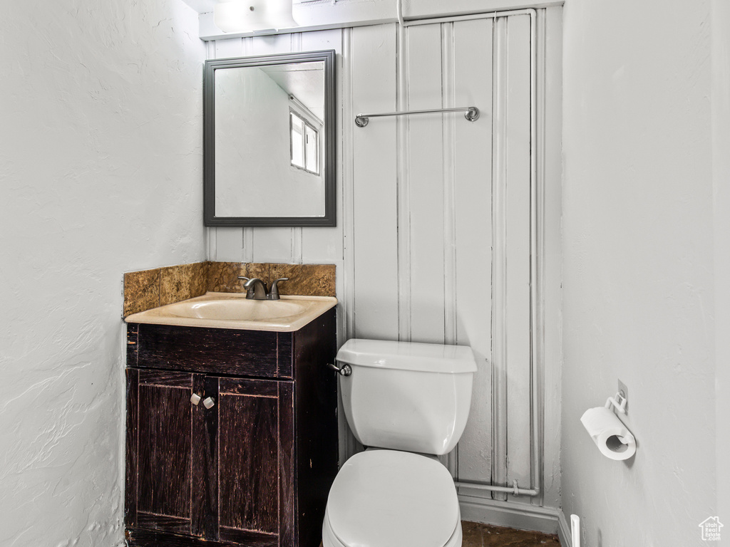 Bathroom with toilet and vanity