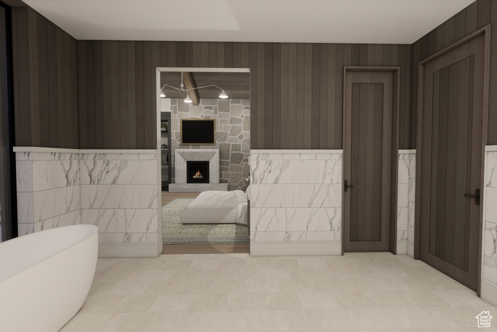 Bathroom featuring a fireplace and tile patterned flooring