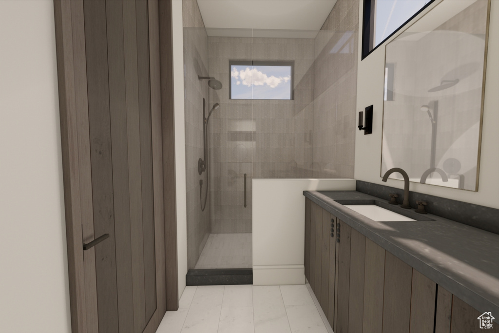 Bathroom with vanity, a tile shower, and tile patterned floors