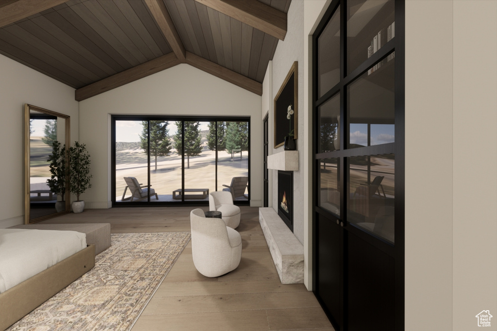 Interior space featuring lofted ceiling with beams and wood ceiling