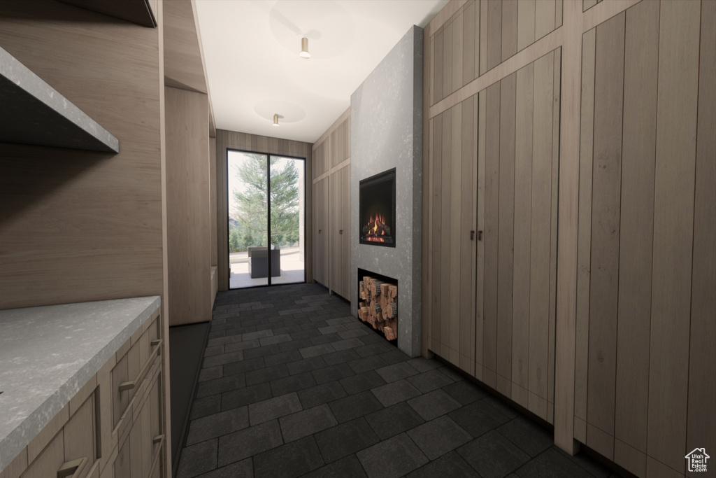 Interior space featuring dark tile patterned floors