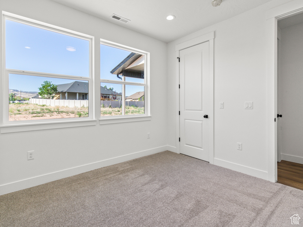 Unfurnished bedroom featuring carpet