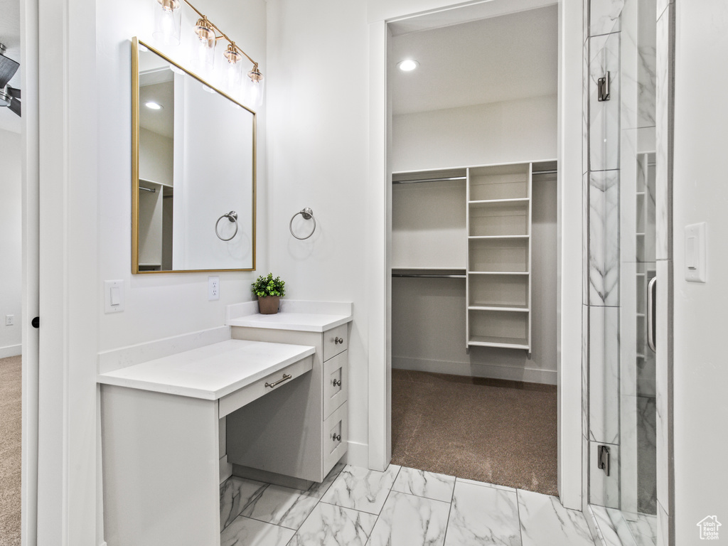 Bathroom featuring vanity and tile patterned flooring