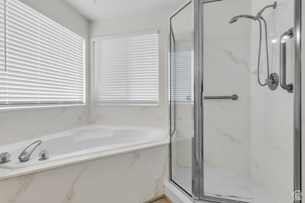 Bathroom with independent shower and bath and a wealth of natural light