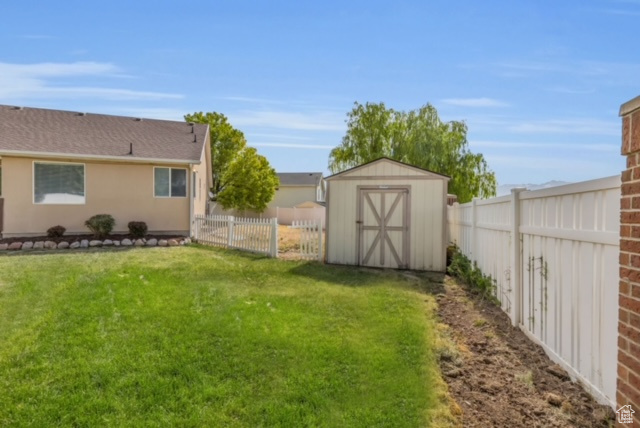 View of yard featuring a storage unit