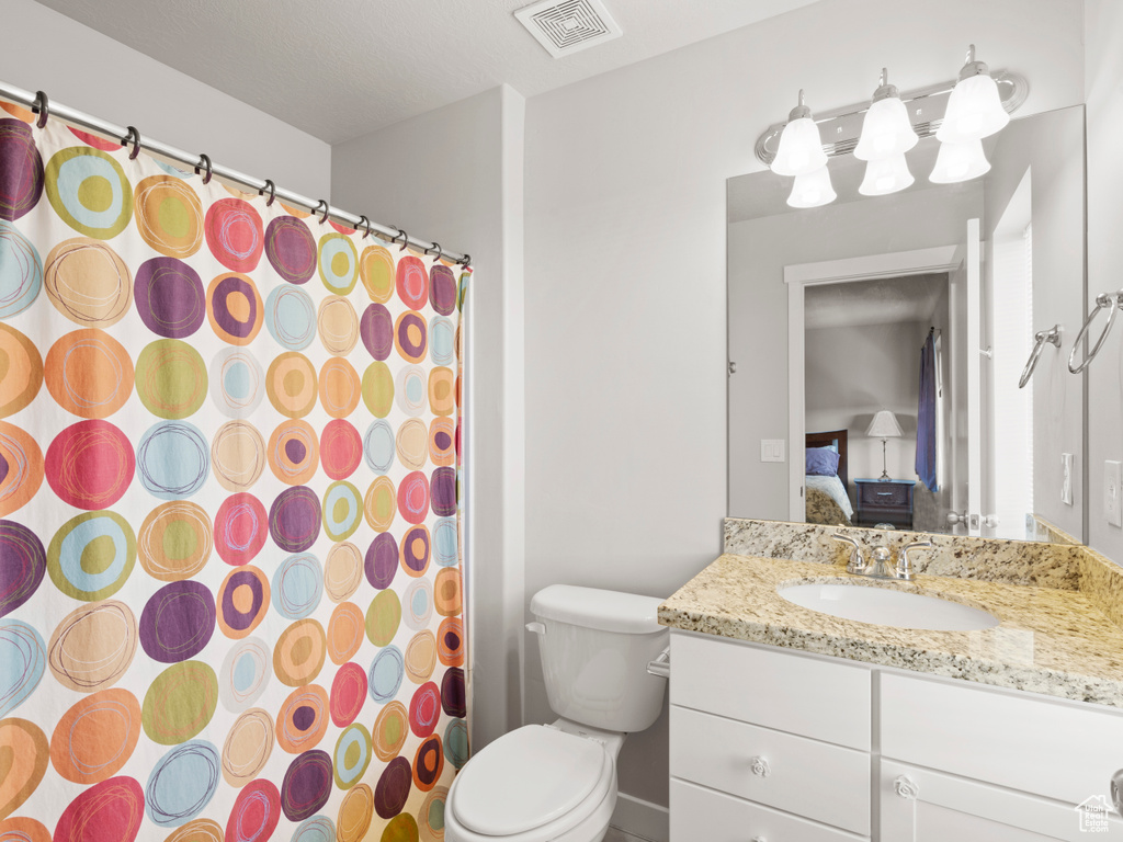 Bathroom with toilet and vanity