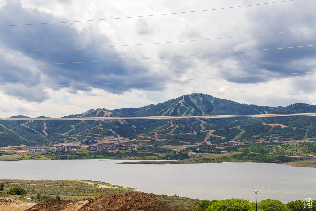 Property view of mountains featuring a water view