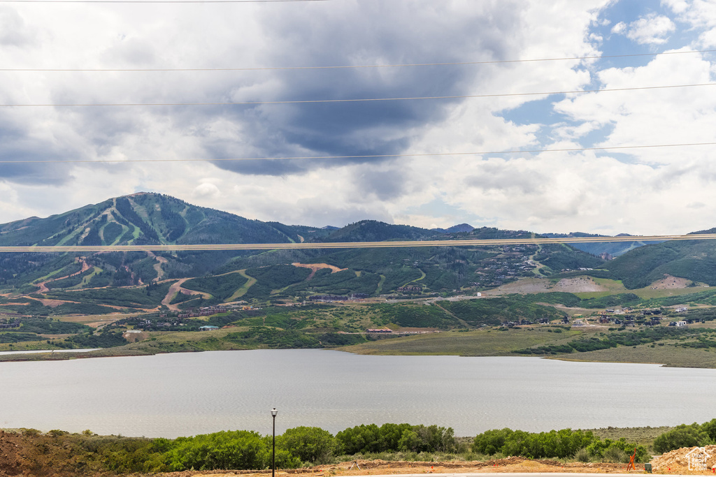 Mountain view featuring a water view