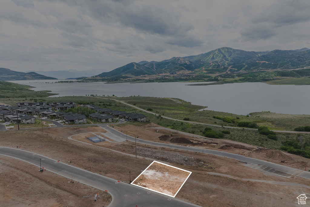 Property view of mountains featuring a water view