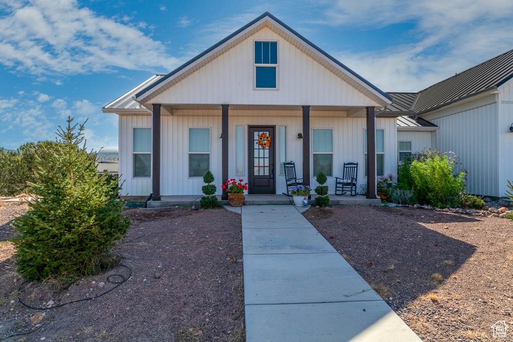 Bungalow featuring covered porch