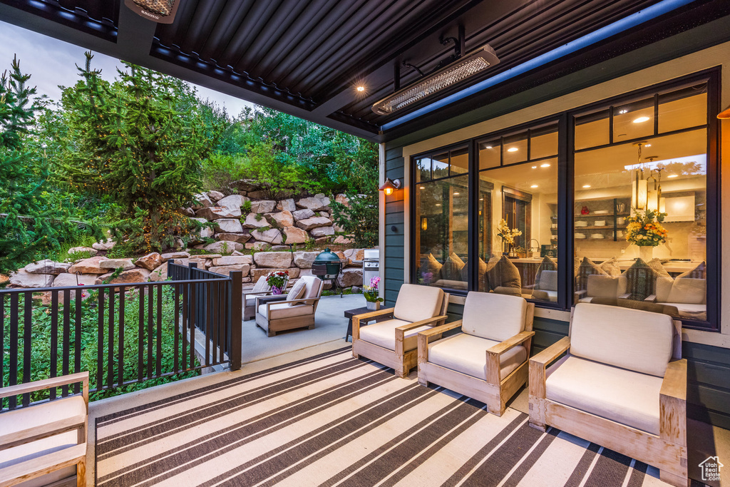 Wooden deck featuring an outdoor hangout area