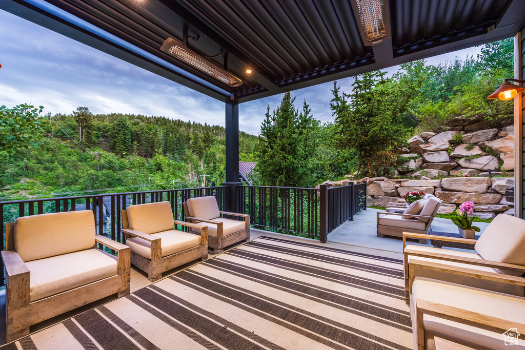 Wooden deck featuring outdoor lounge area