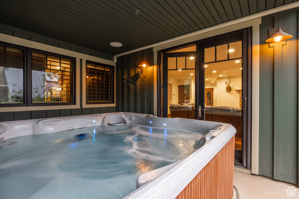 Exterior space with a hot tub