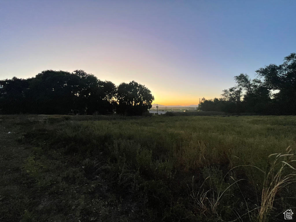 Nature at dusk featuring a rural view