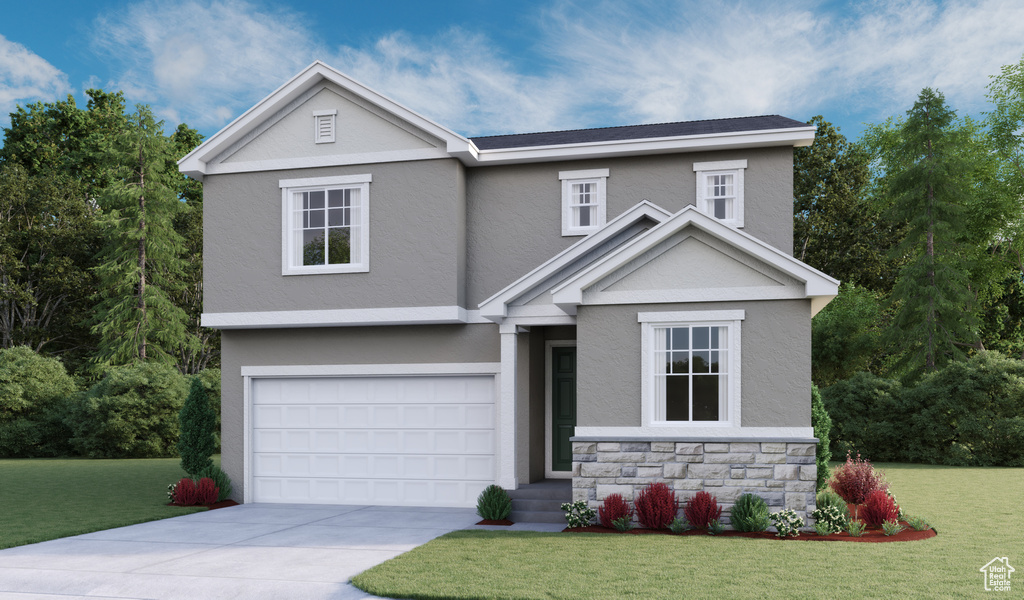 View of front facade featuring a front lawn and a garage