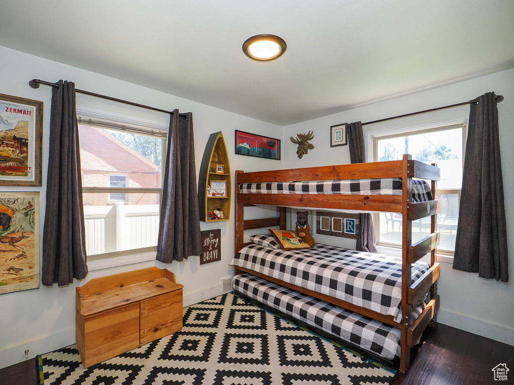 Bedroom with hardwood / wood-style floors