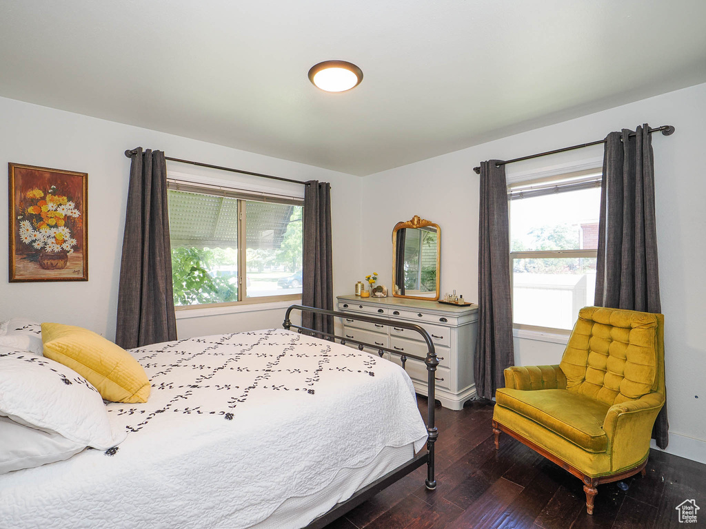 Bedroom with hardwood / wood-style floors