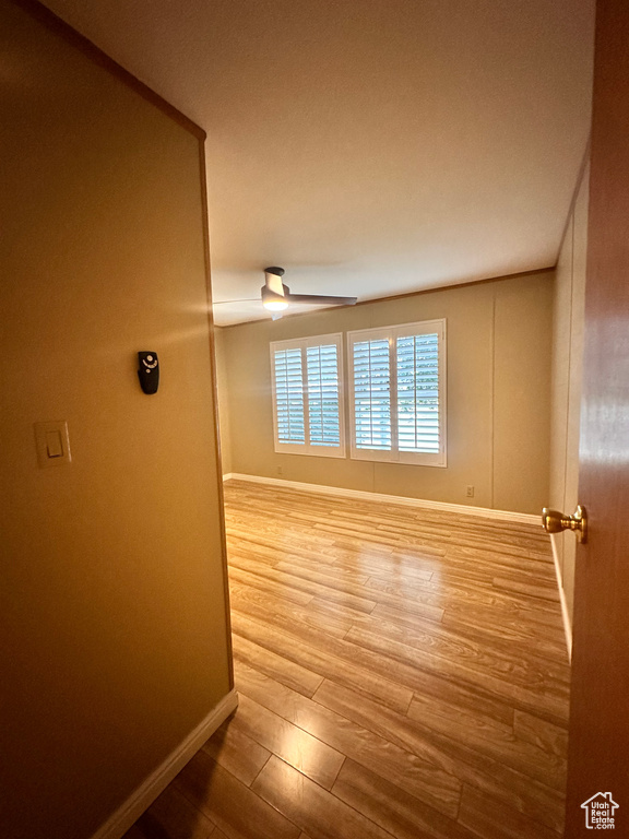 Spare room featuring hardwood / wood-style flooring and ceiling fan