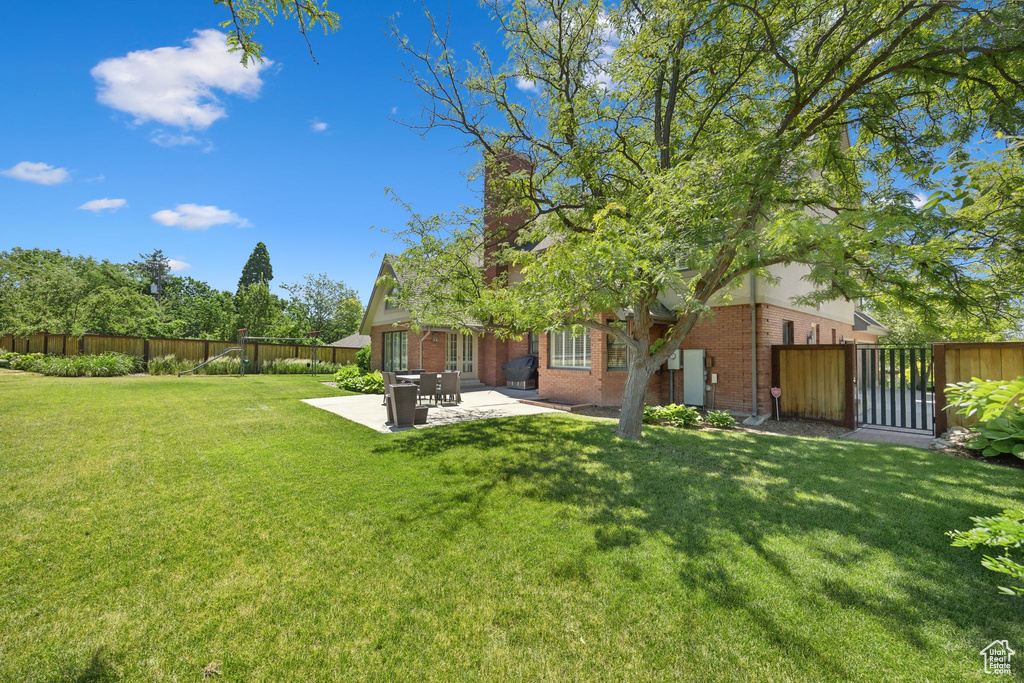 View of yard featuring a patio