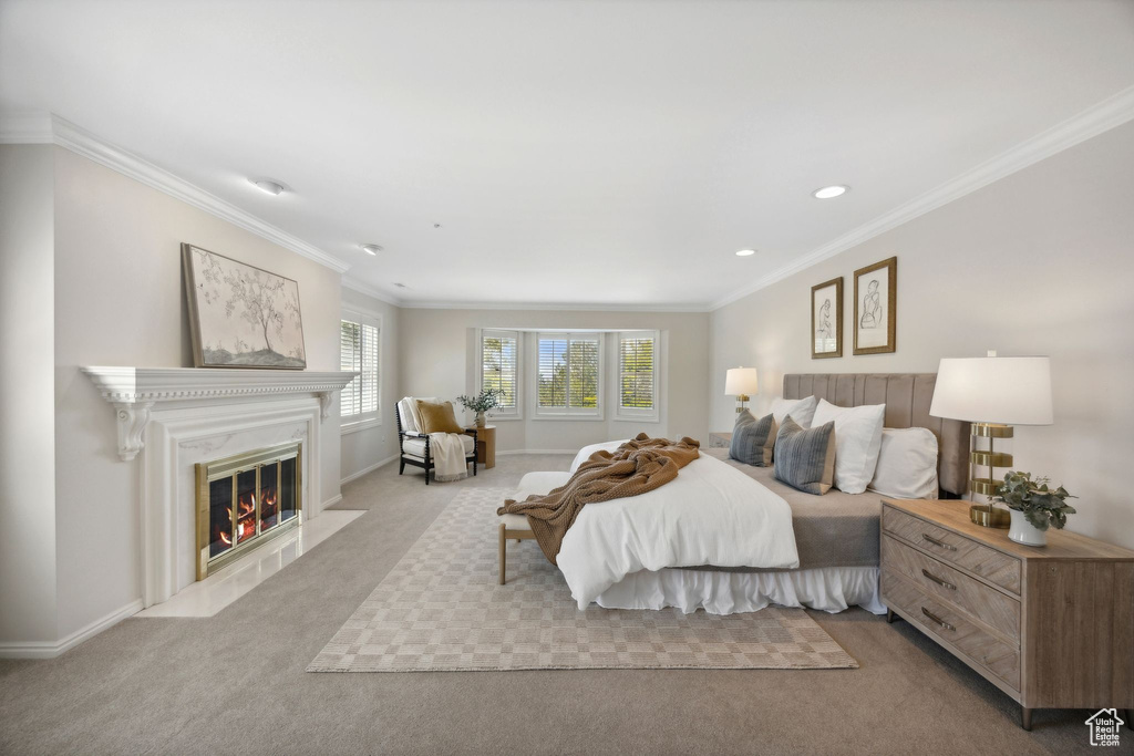 Bedroom featuring crown molding and light colored carpet