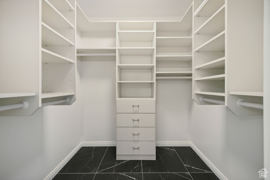 Spacious closet with tile patterned floors