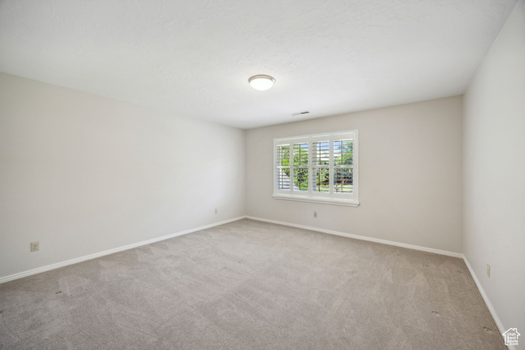 Empty room featuring carpet