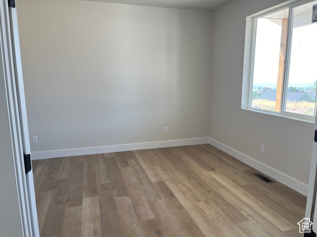 Spare room with light hardwood / wood-style flooring