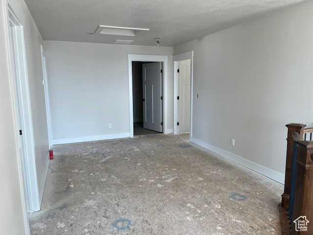 Spare room with a textured ceiling