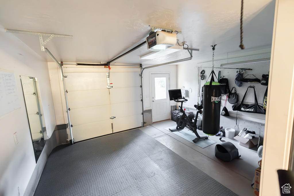 Garage featuring a garage door opener