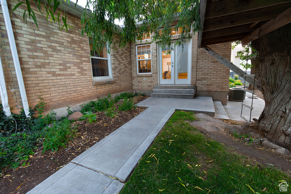 Doorway to property with cooling unit