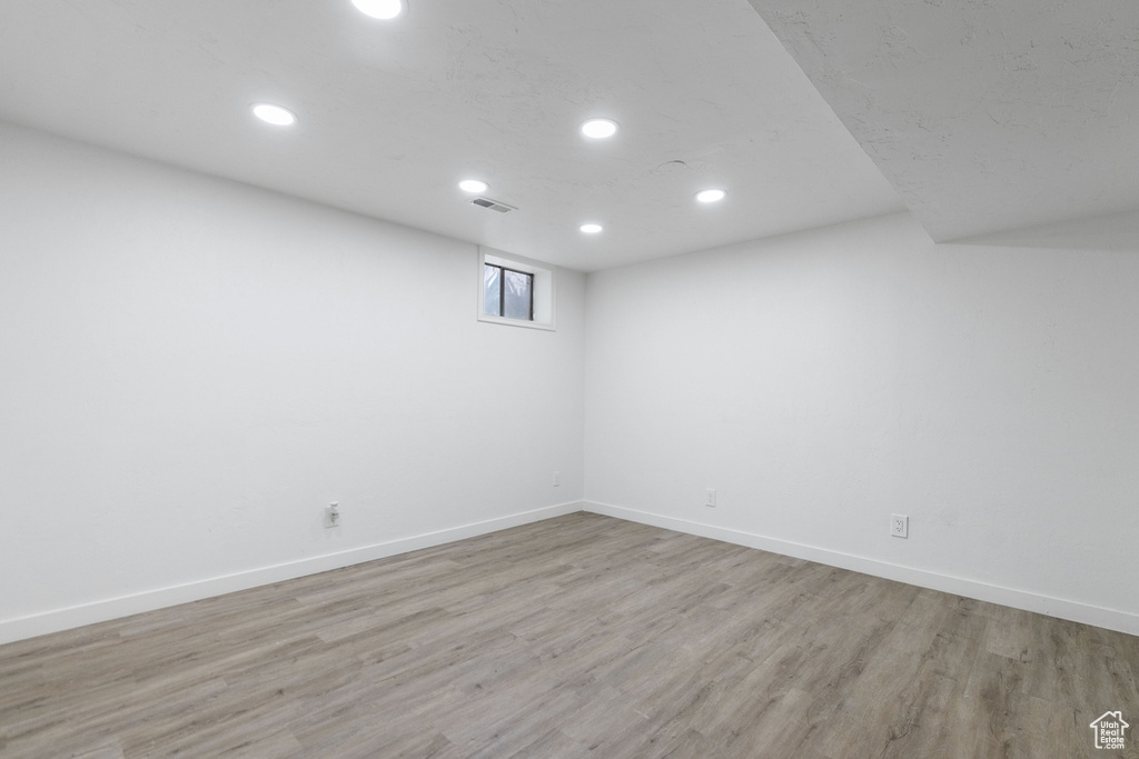 Spare room with wood-type flooring