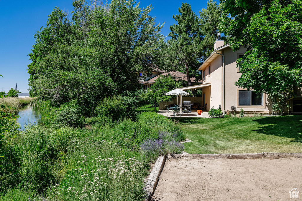 View of yard with a patio area