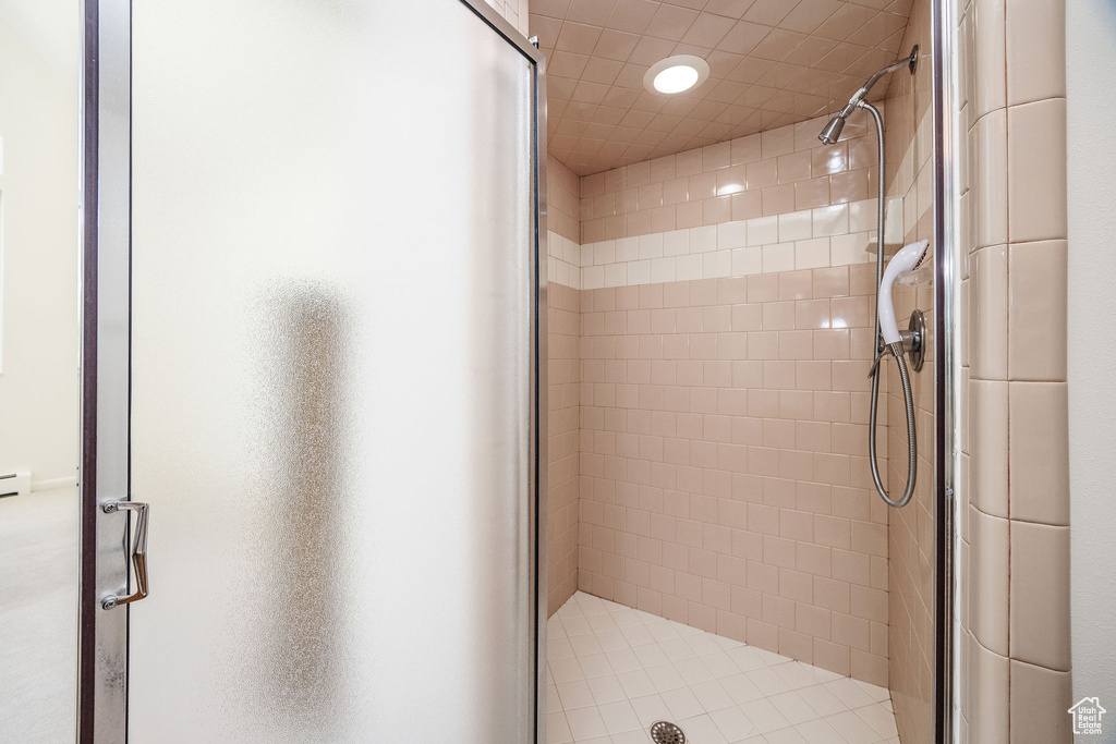 Bathroom with a shower with door