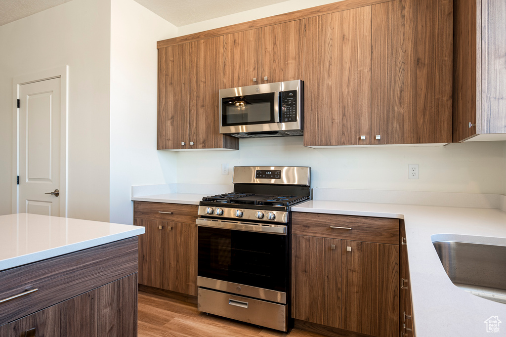 Kitchen featuring stainless steel appliances and light wood-type flooring