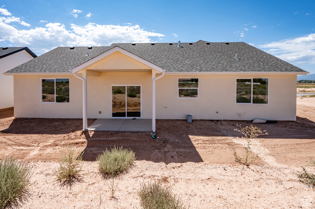 Back of property with a patio area