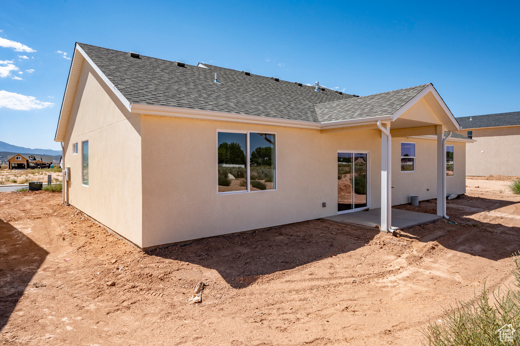 Rear view of property with a patio