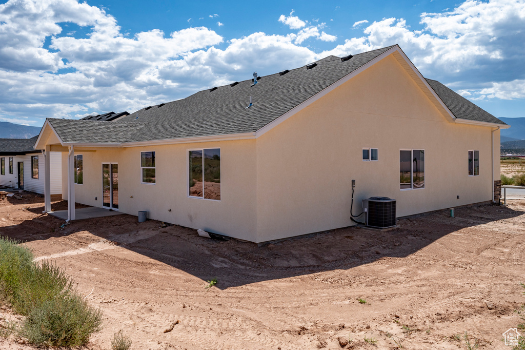 Back of house featuring a patio and central air condition unit