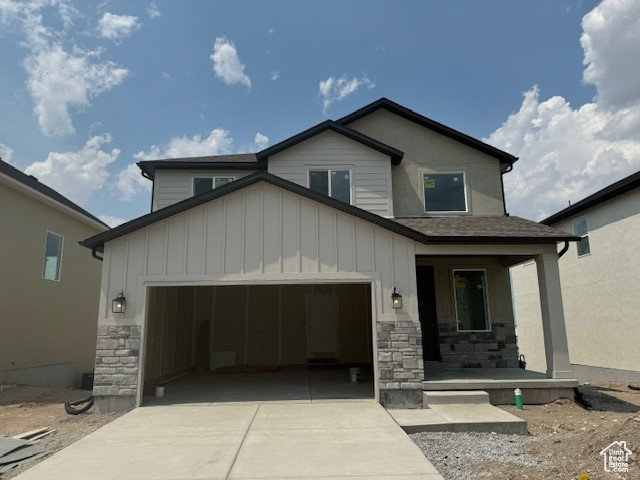 View of front of home featuring a garage