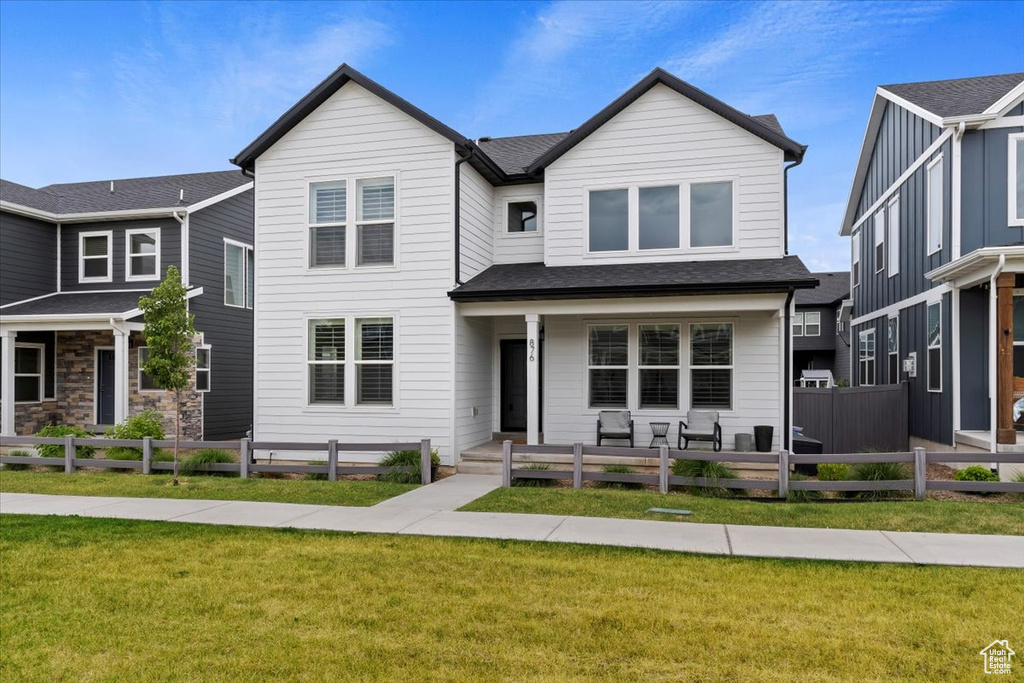 View of front of house with a front yard