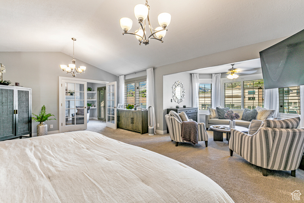 Bedroom with lofted ceiling, carpet flooring, a notable chandelier, and french doors