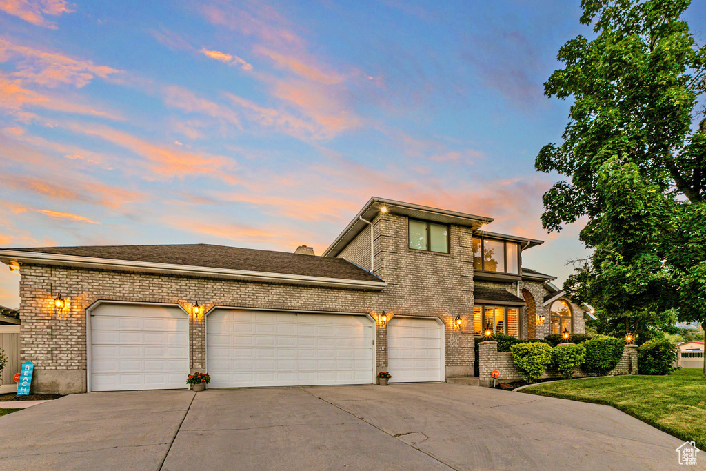 View of front of property with a garage