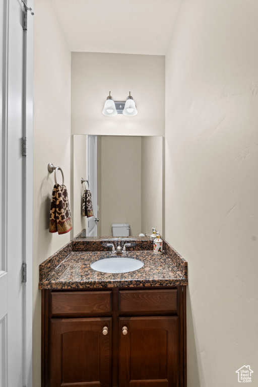 Bathroom featuring toilet and vanity