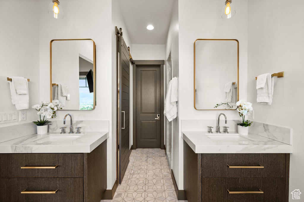 Bathroom with vanity and tile patterned flooring