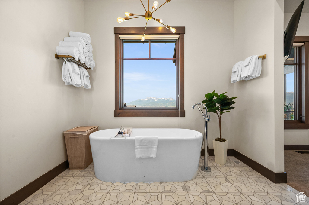 Bathroom featuring a bath and tile patterned floors