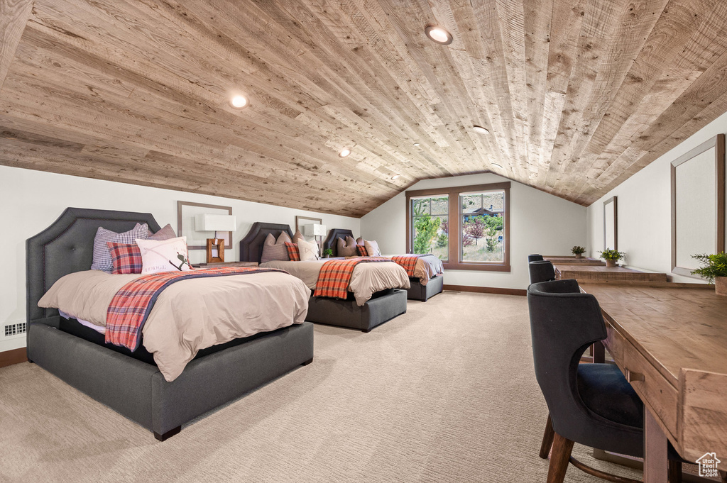 Carpeted bedroom with lofted ceiling and wooden ceiling